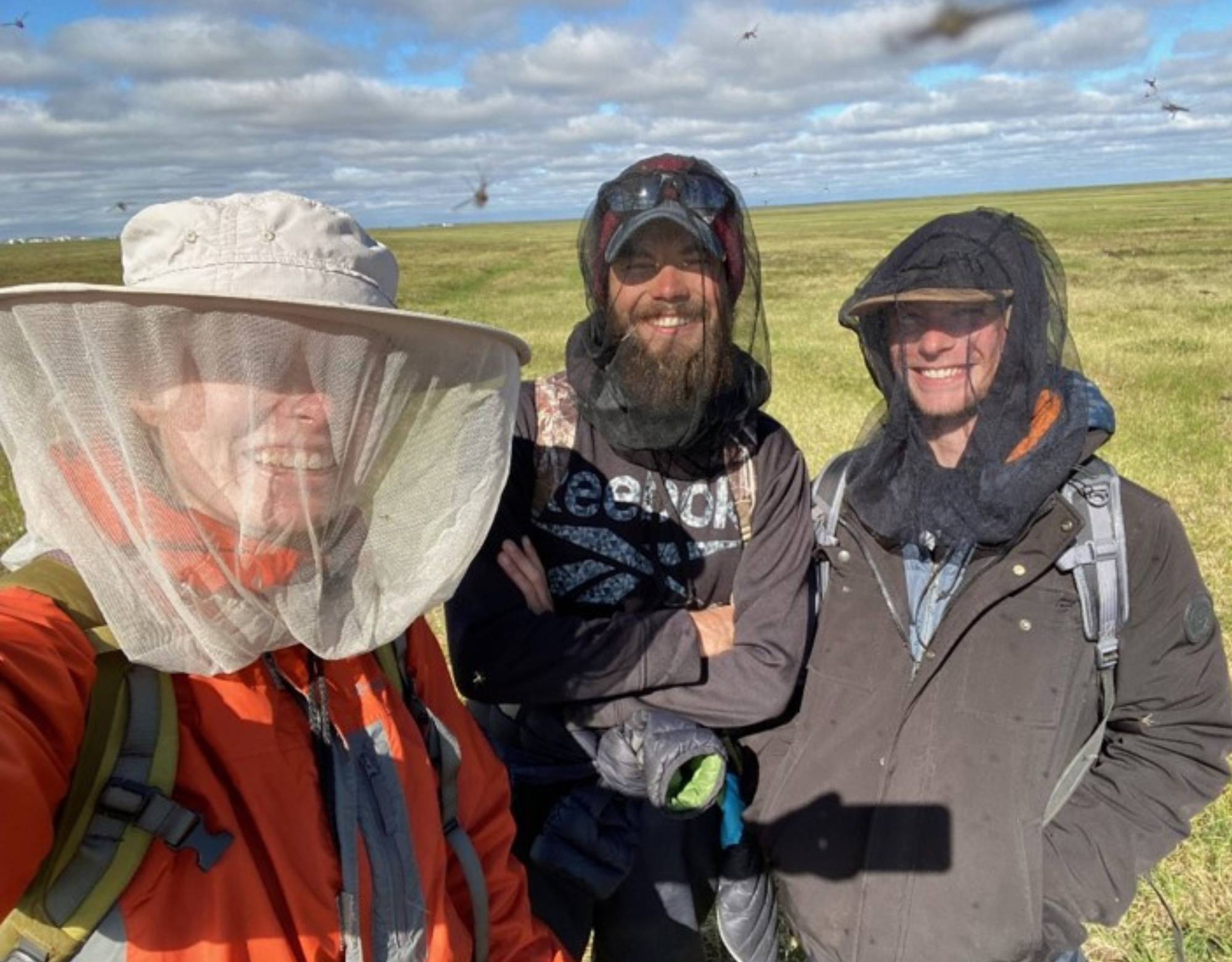 Hana, Justin, and Taylor enjoy the bugs in Atqasuk